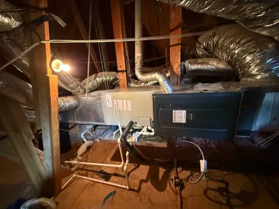 Air handler and ductwork installed in an attic