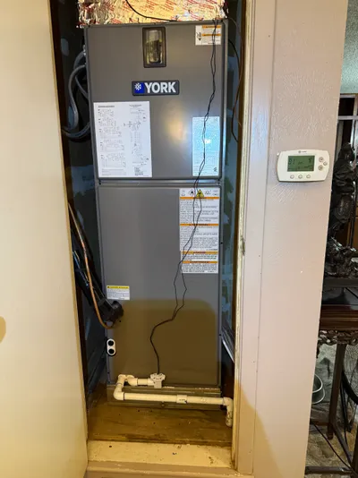 Furnace and air handler installed in a utility closet